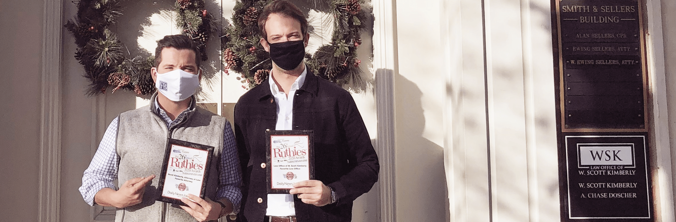 Two Men in Masks Holding Books in Hand