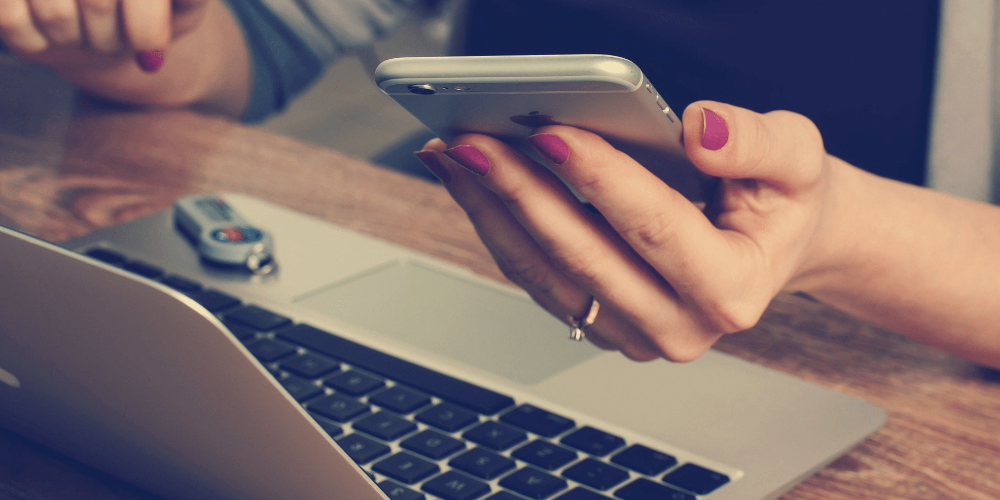 A Woman Holding a Phone in Hand Looking at Screen