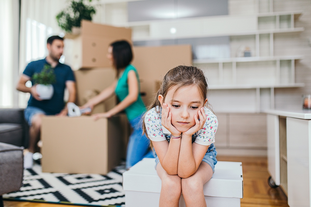 A Family Sorting Out Boxed on the Floor